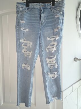 American Eagle- High Waisted, Light Blue Distressed Jeggings-size 16